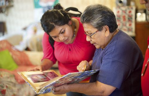 Two women looking at a book