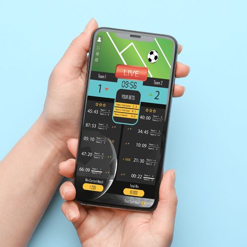 スポーツギャンブルアプリが表示された携帯電話
