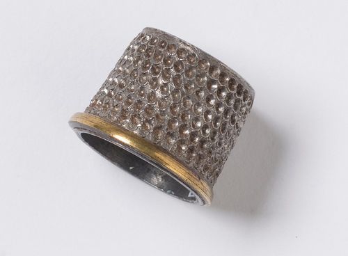 Photograph of a thimble.