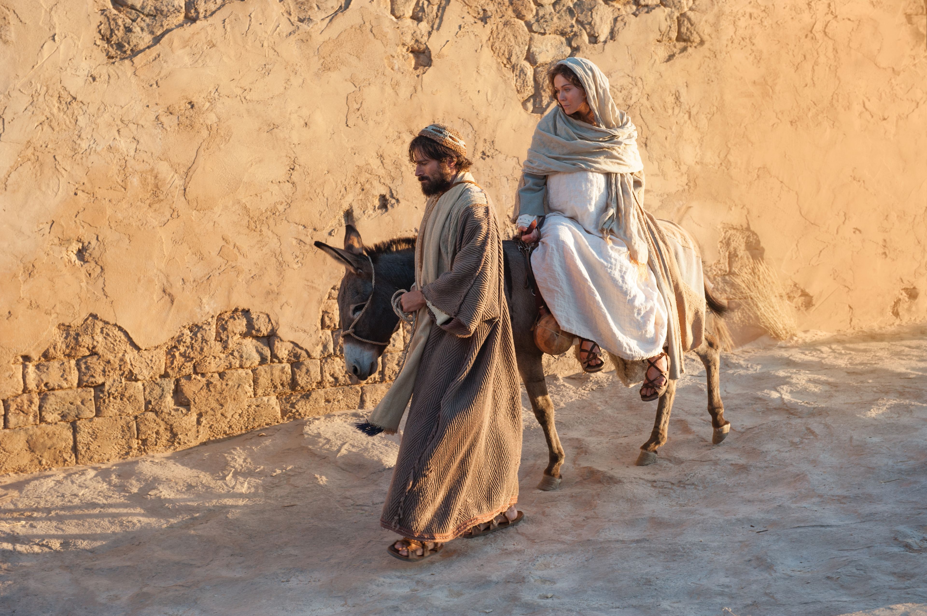 Mary and Joseph ride into Bethlehem at the end of their journey.