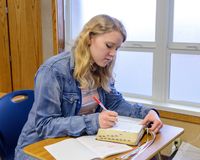 young person studying the scriptures