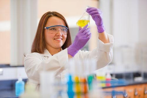 A young woman in a chemistry lab.