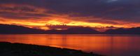 red sunrise over lake