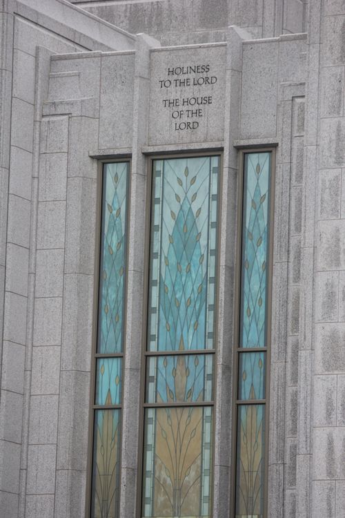 The stained glass on the Calgary Alberta Temple, with the inscription “Holiness to the Lord: The House of the Lord” on the stone above the window.