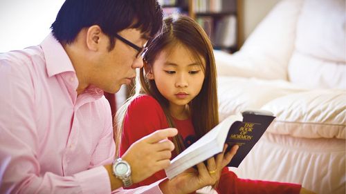 parents teaching their children the gospel