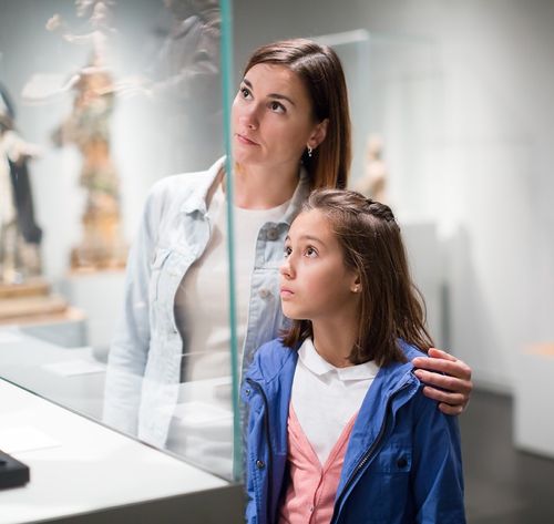 woman and girl admiring art in museum