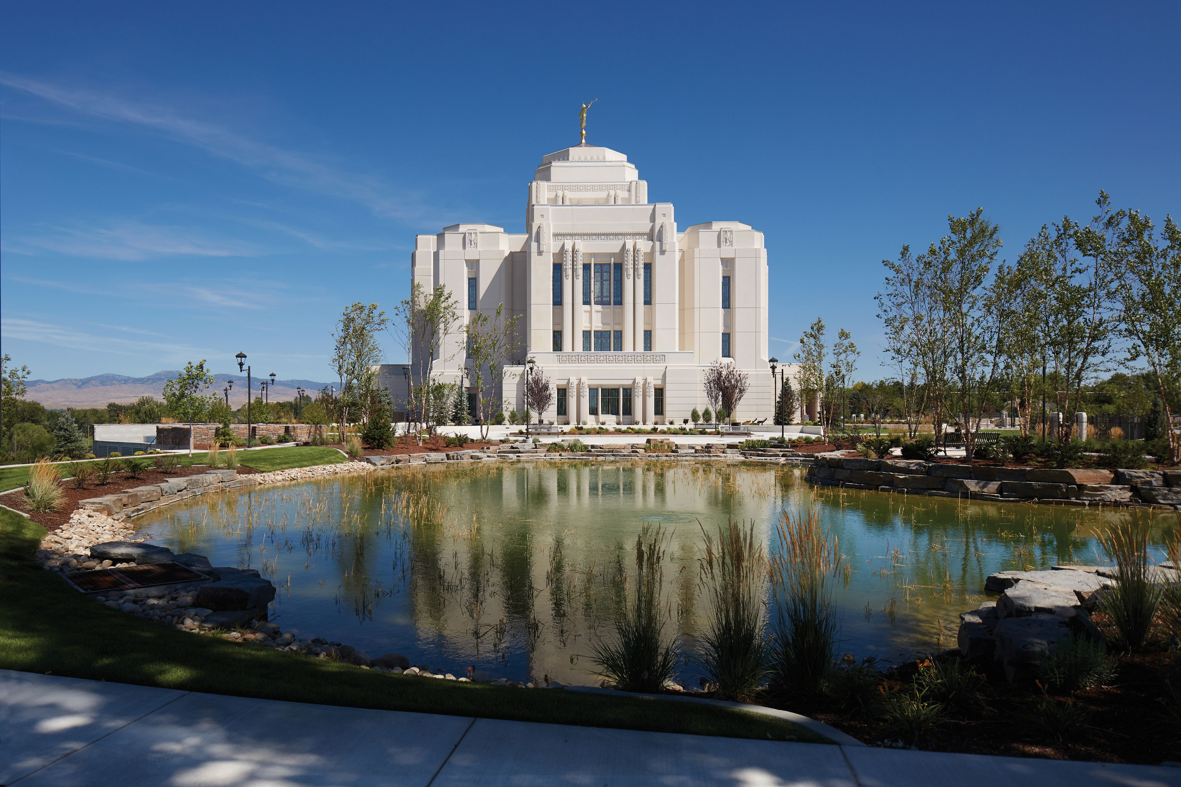 A photograph of the Meridian Idaho Temple overlooking a pond.