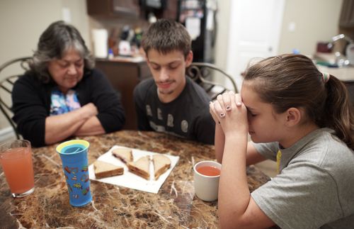 family praying