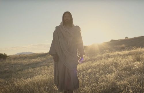 Jesus Christ walking with the sun shining