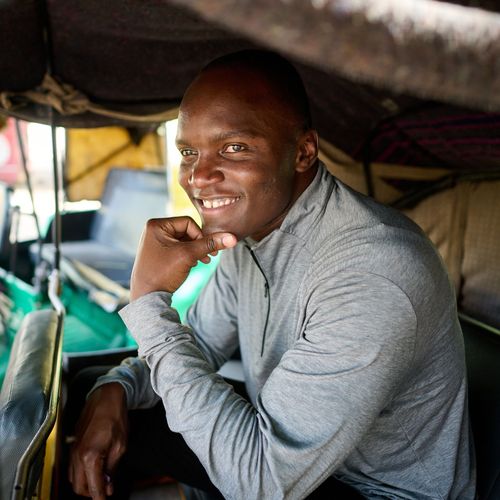 man sitting and smiling