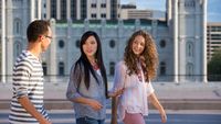 Group of youth walking in front of the Salt Lake Temple