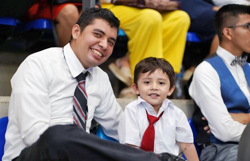 boy and his dad wearing suit and ties