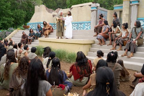 The resurrected Savior, Jesus Christ, demonstrates the proper method for baptism. Nephi stands with him during the demonstration.