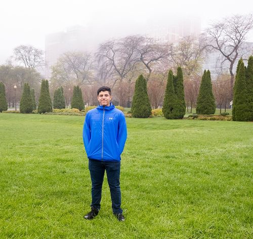 young man in a cloudy city