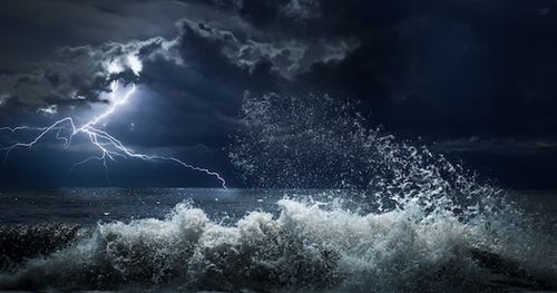 dark ocean storm with lighting and waves at night