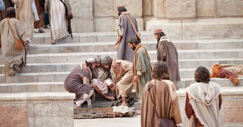 Men carry a friend set him on the steps