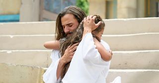 Christ hugging a child