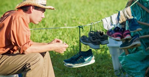 young man drying out clothes