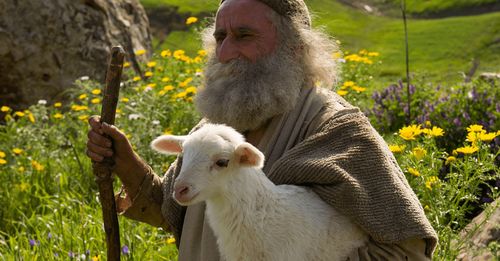 Shepherd carrying the lost lamb. Outtakes include the shepherd holding the sheep, walking with the lamb returning to the other shepherd, as well as some shots with the filming crew.