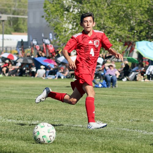 young man playing soccer