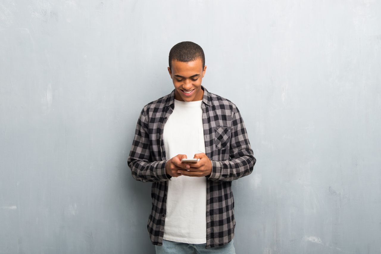 A man taking gospel lessons on his smartphone