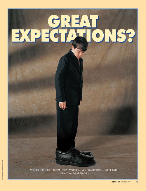 A conceptual photograph of a young boy in a black suit wearing shoes that are much too big, paired with the words “Great Expectations.”