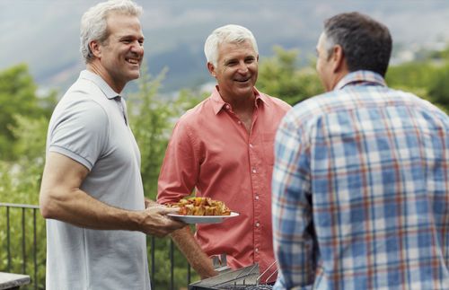 men at a barbecue