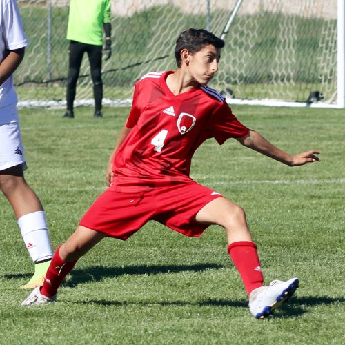 young man playing soccer