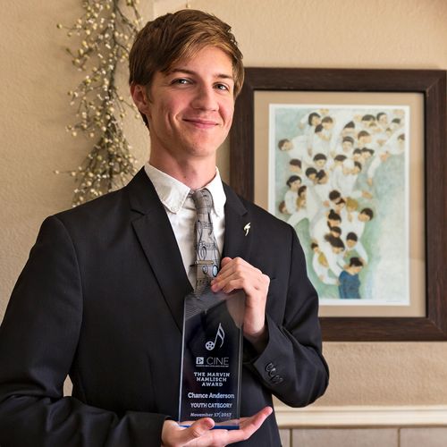 Young man with award