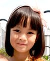 Headshot of young girl with bangs
