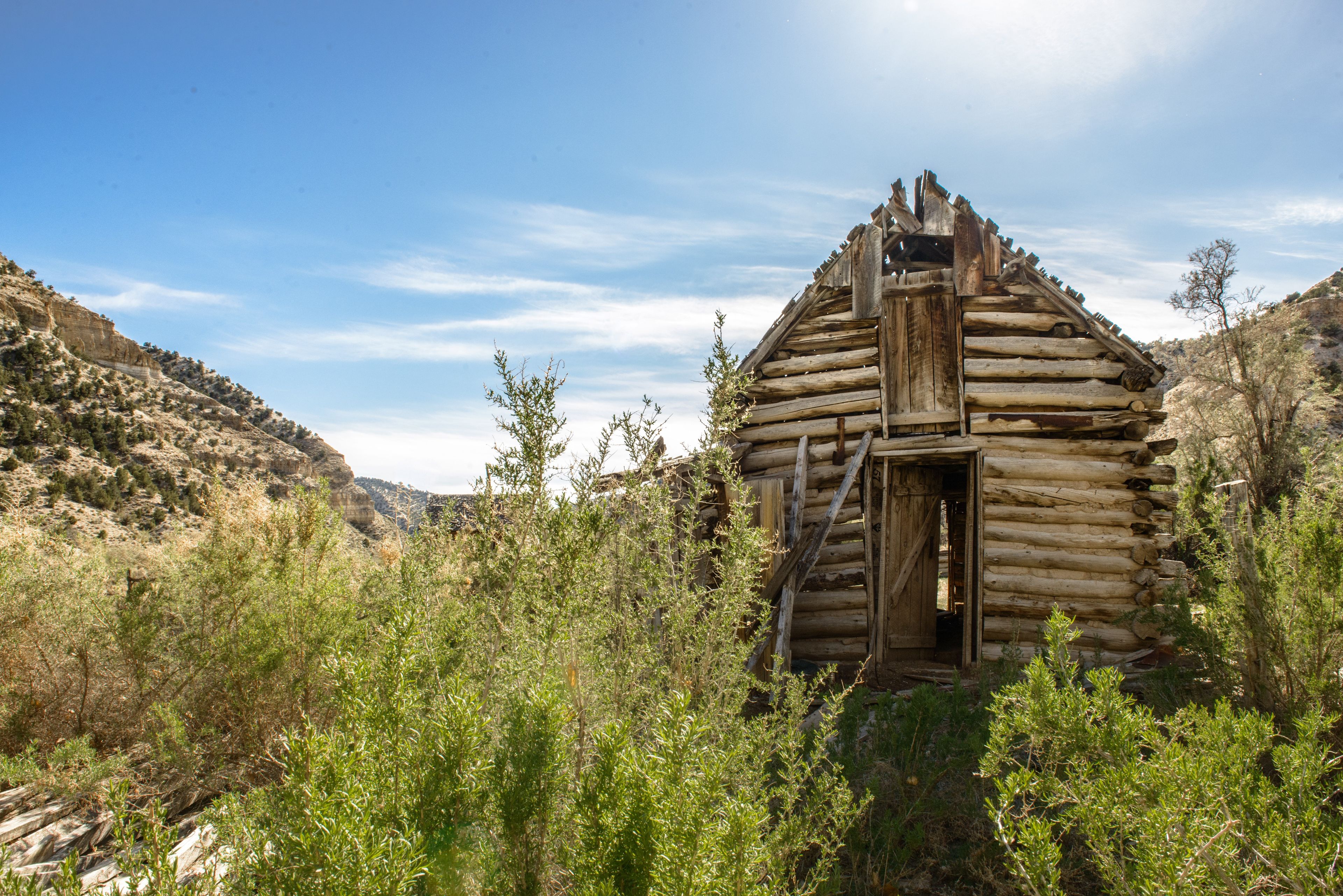 An old, decaying cabin on a desert mountain.