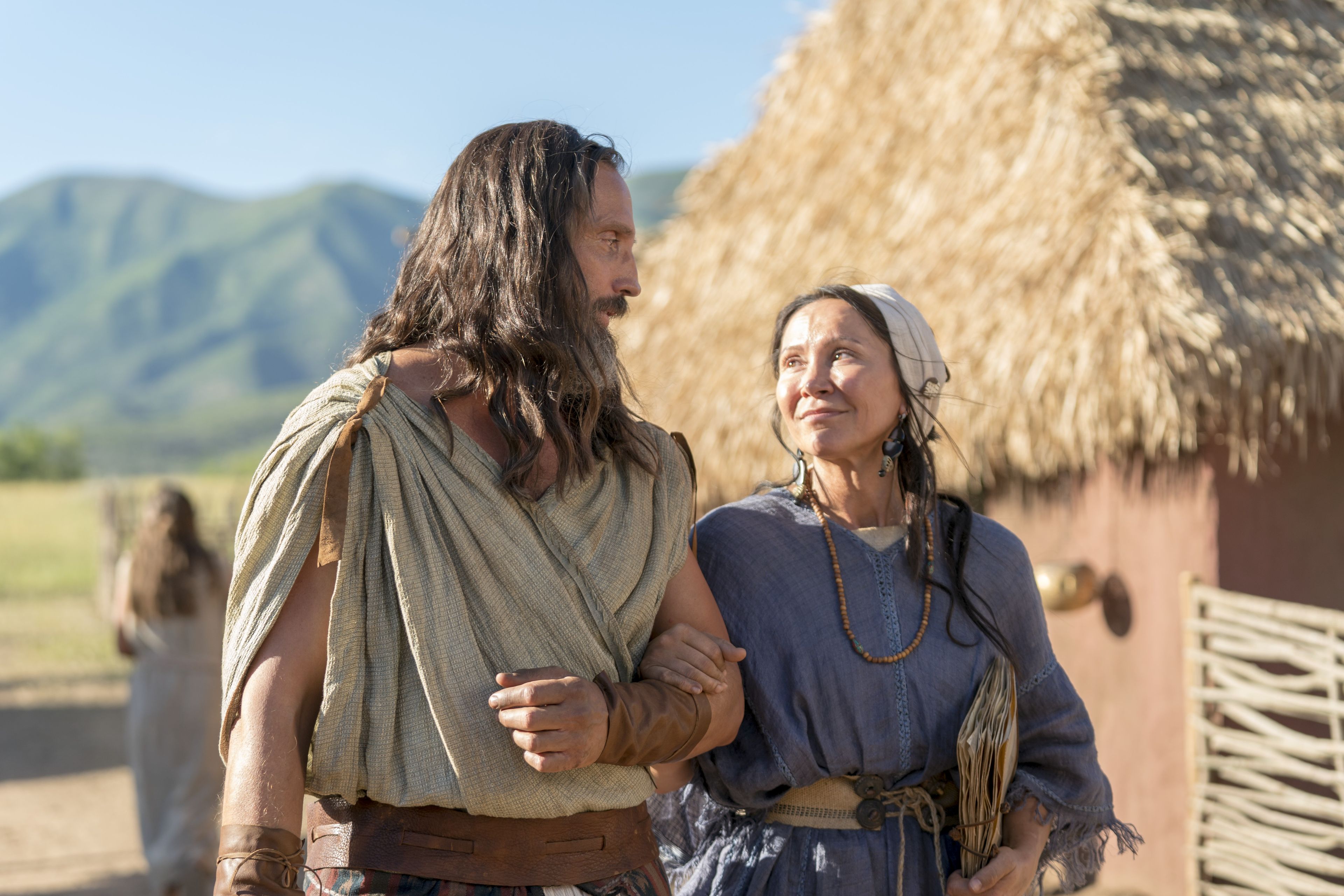Nephi walks with his wife.