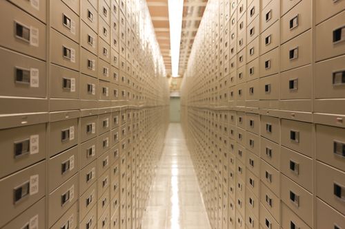 A view down the aisle, with cabinets on each side filled with microfiche, at the Granite Mountain Records Vault.