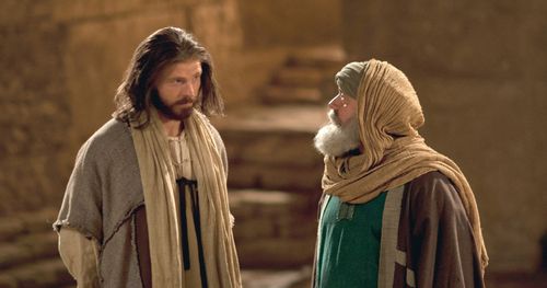 Jesus and Nicodemus standing near a pool of water at night talking. Outtakes include the two sitting by the pool with their fingers near the water, Jesus standing and touching a branch of a tree while Nicodemus sits, and some of the shots taken from above.