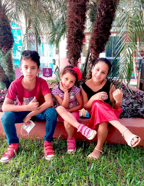 Three children on a bench