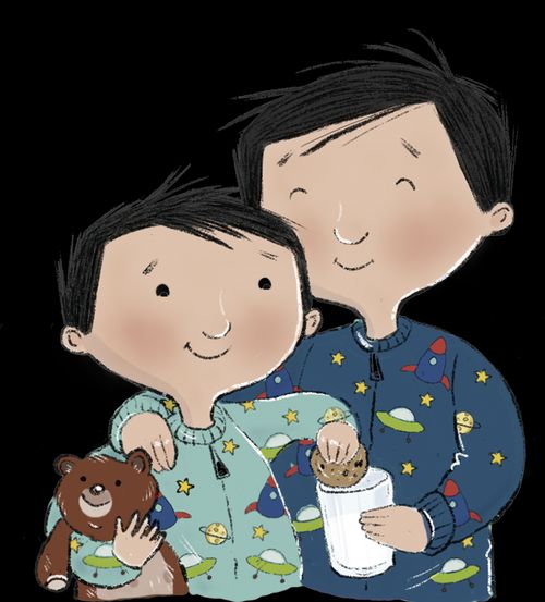 Dad and son in pajamas eating milk and cookies