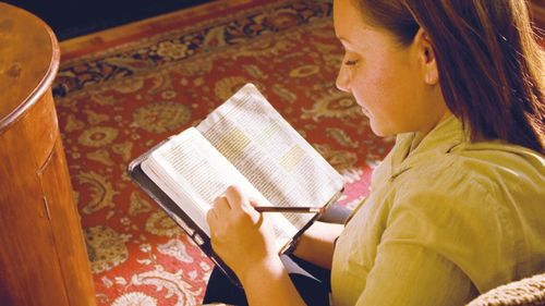 student marking scriptures