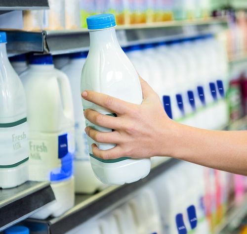 taking milk off shelf