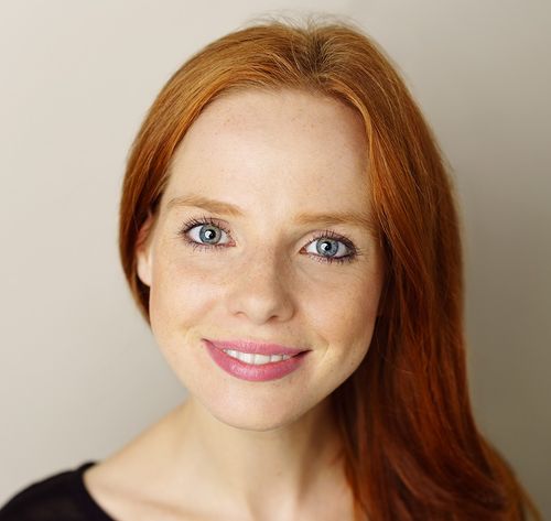 smiling woman with red hair