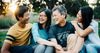 family smiling outside