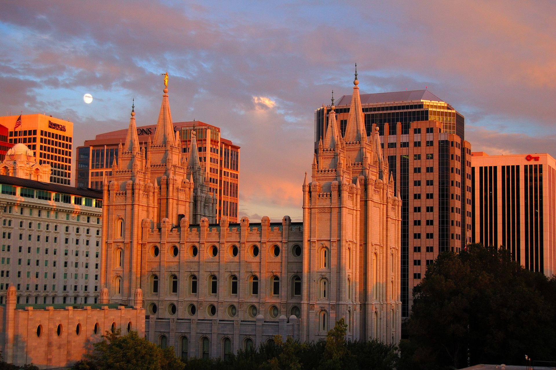 The Salt Lake Temple at sunset, including the scenery and city.
