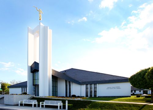 A front side view of the Freiberg Germany Temple, with the angel Moroni on top of the spire to the left.