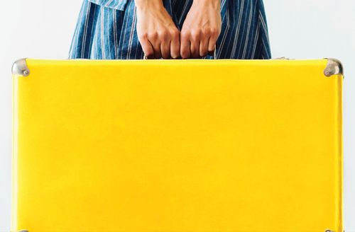 girl with yellow suitcase