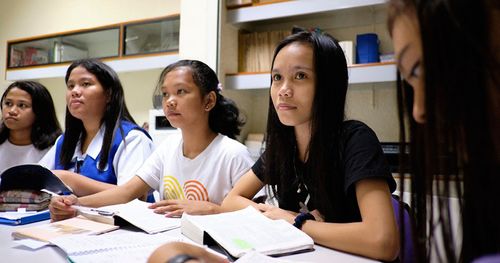 young women studying the gospel