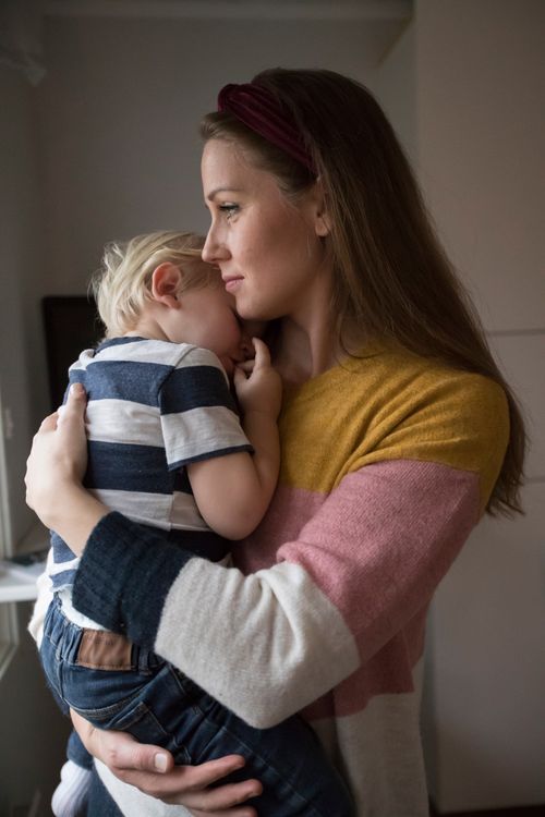 woman comforting her child