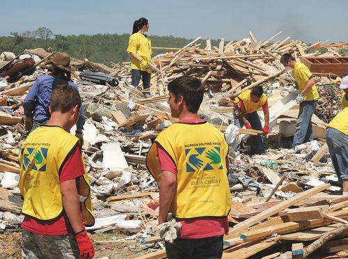 Helping Hands workers sorting through debris