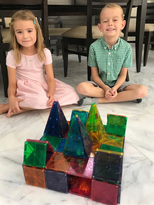 brother and sister with temple they built