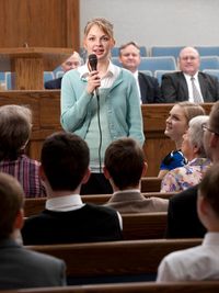 young woman bearing her testimony