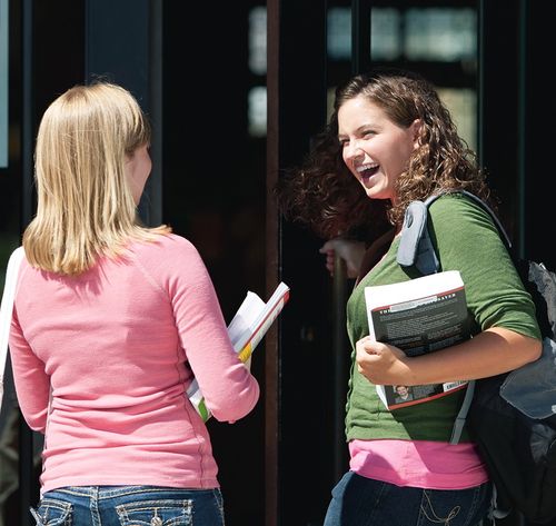 two women talking after class