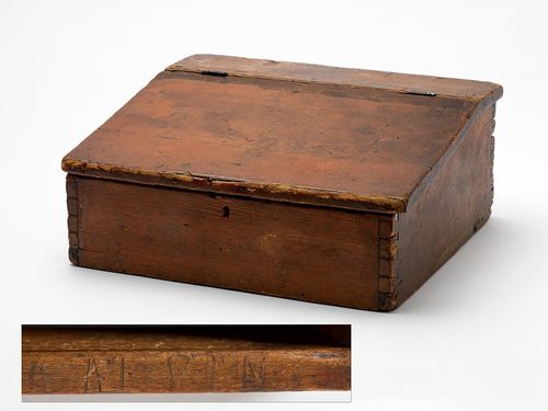 Wooden box with a hinged lid.